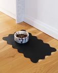 Le Noof's wavy reversible dog bowl mat on the floor with marble dog bowl