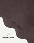 Brown side of wavy double-sided dog bowl mat, Le Noof