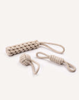 Beige rope dog toy with a knotted end on a white background