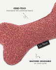 Dusty pink boucle bone dog toy close-up, Le Noof