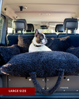 Black teddy travel car dog bed in a car trunk, Le Noof