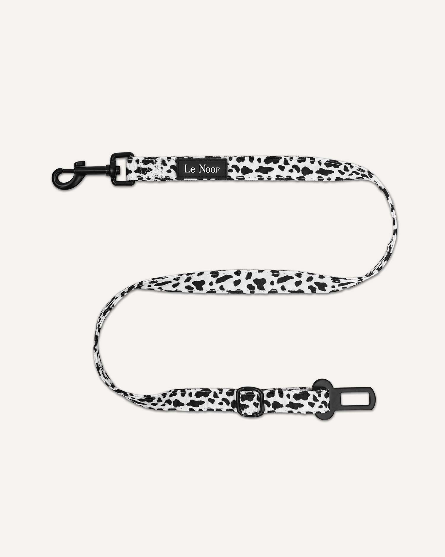 Cow print Le Noof dog seat belt