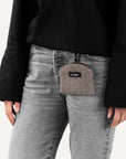 Person wearing dark brown cotton dog treat pouch made by Le Noof