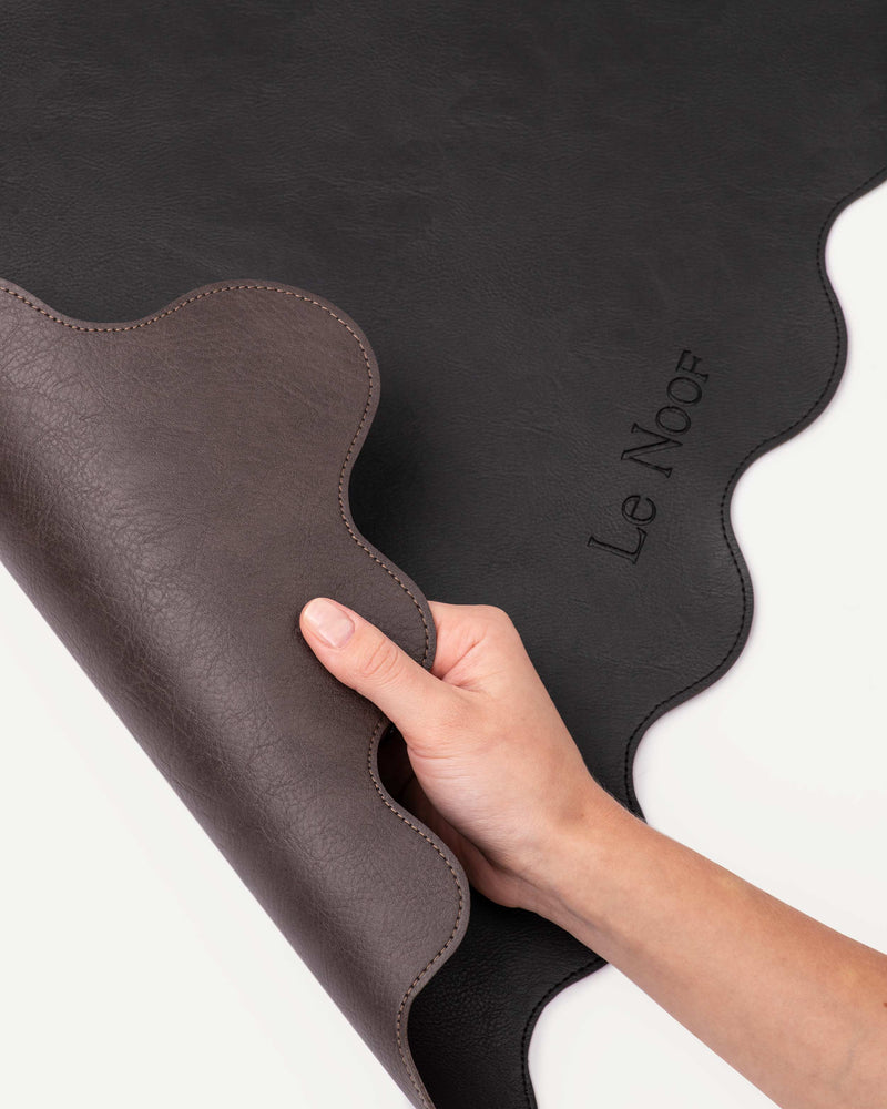 Reversible wavy dog bowl mat by Le Noof in black and brown color