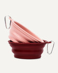 Pink and red collapsible dog bowls