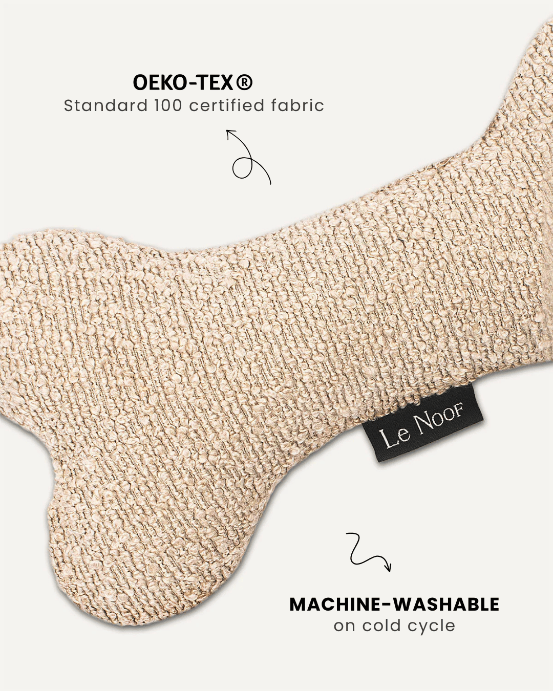 Beige boucle bone dog toy close-up, Le Noof