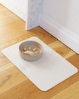 Waterproof dog bowl mat by Le Noof in beige color