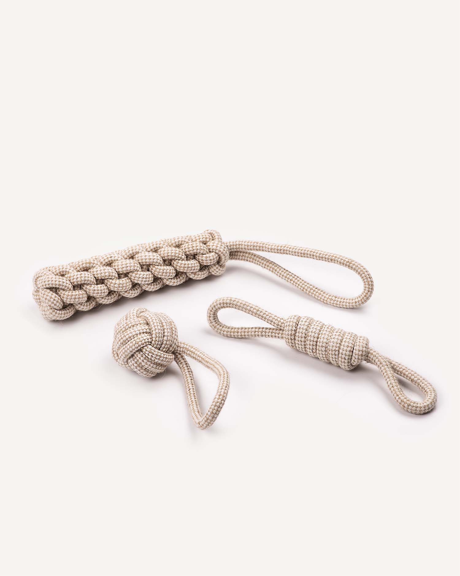 Beige rope dog toy with a knotted end on a white background