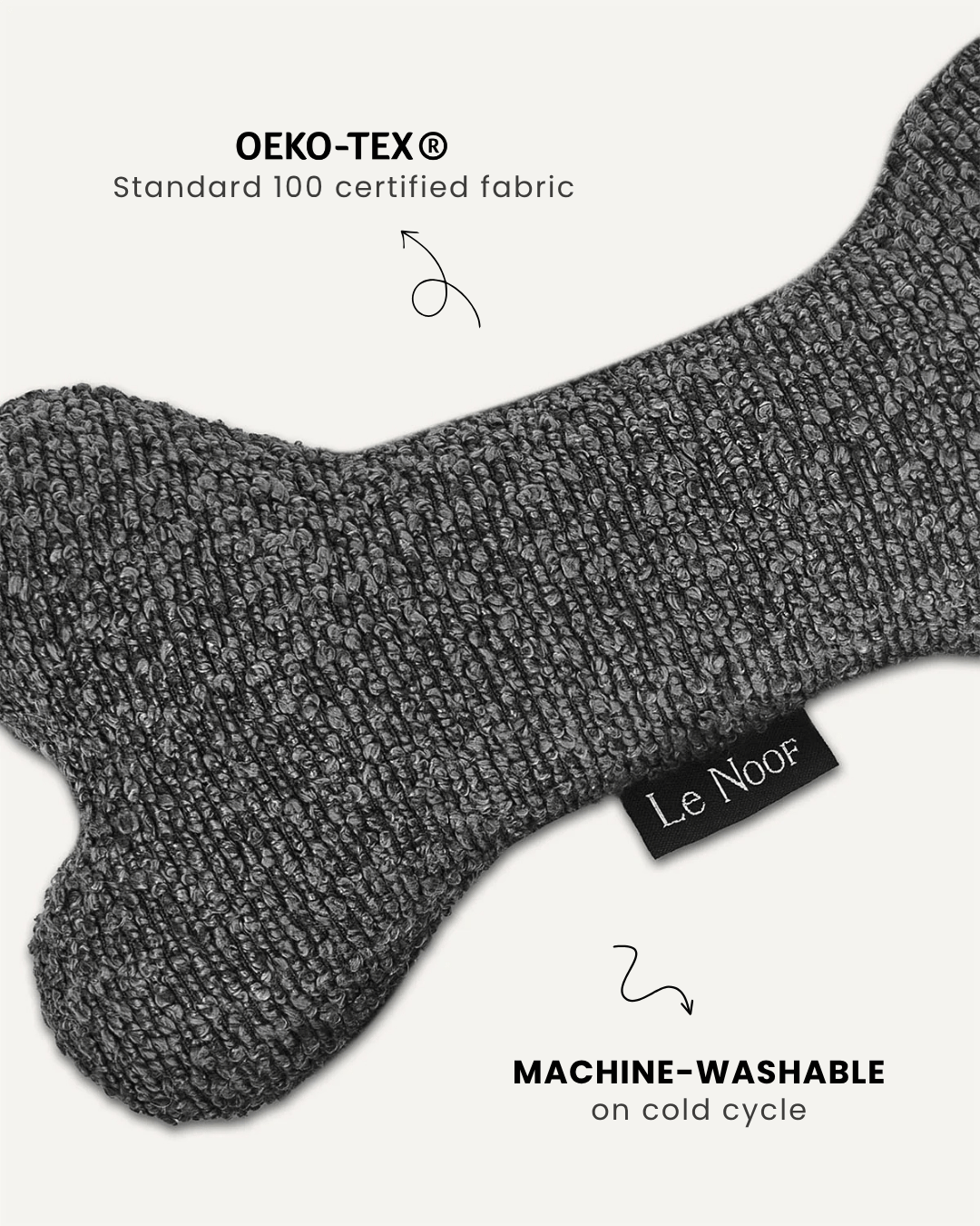 Grey boucle bone dog toy close-up, Le Noof