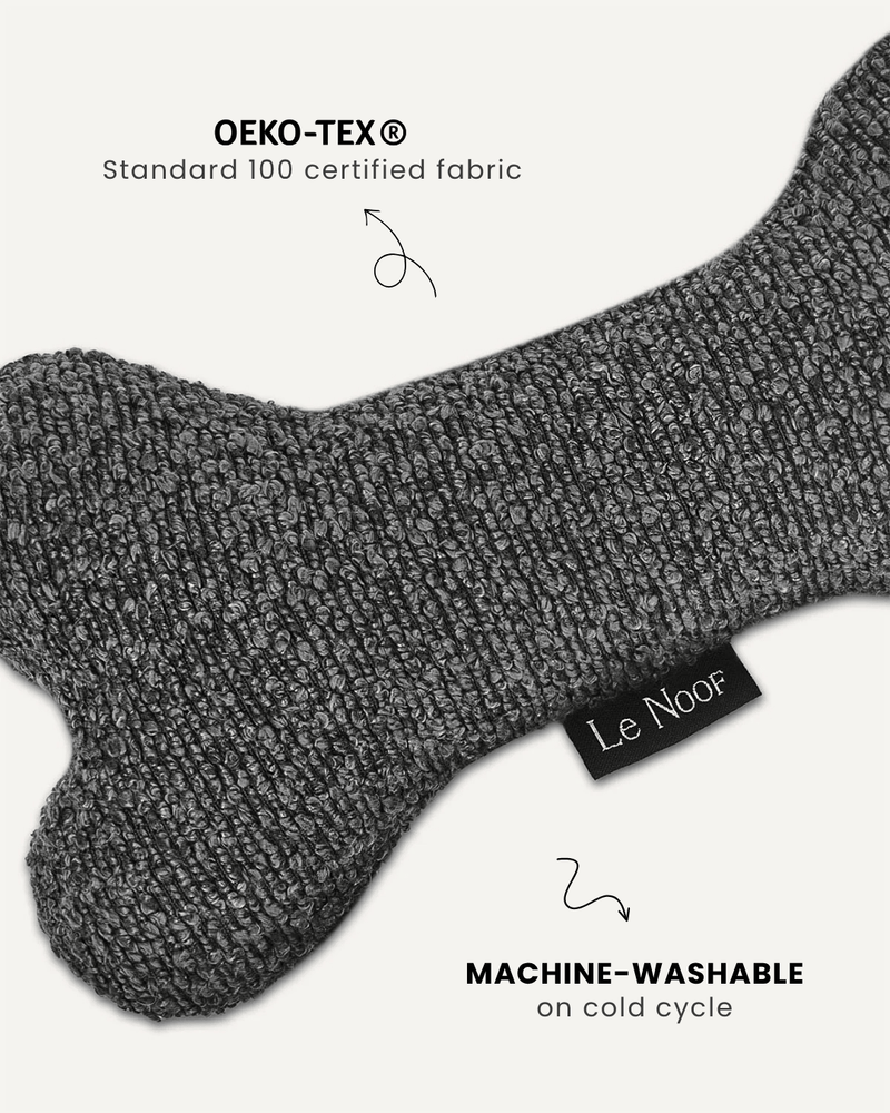 Grey boucle bone dog toy close-up, Le Noof