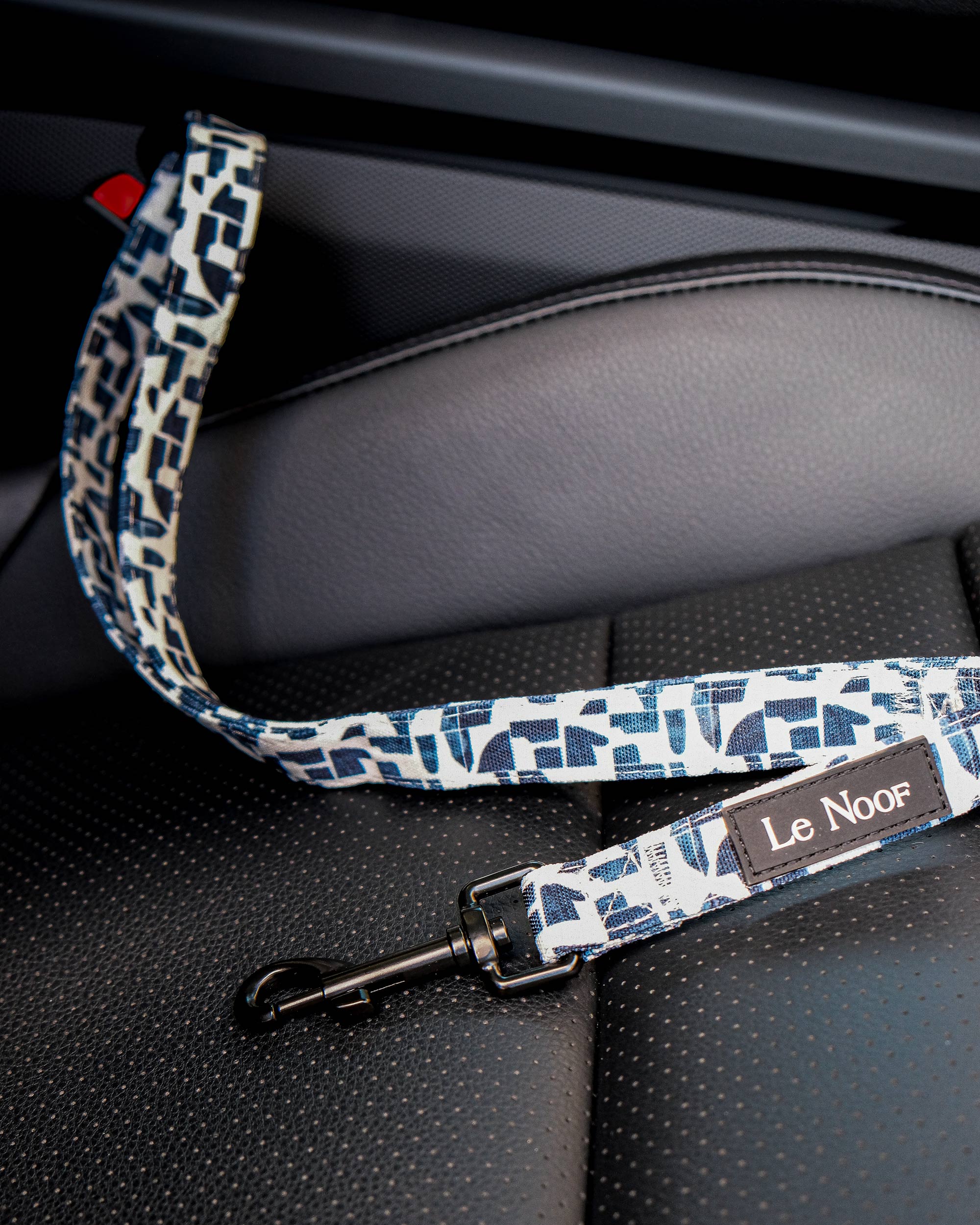 Modern Geometric Print dog seat belt buckled in the car