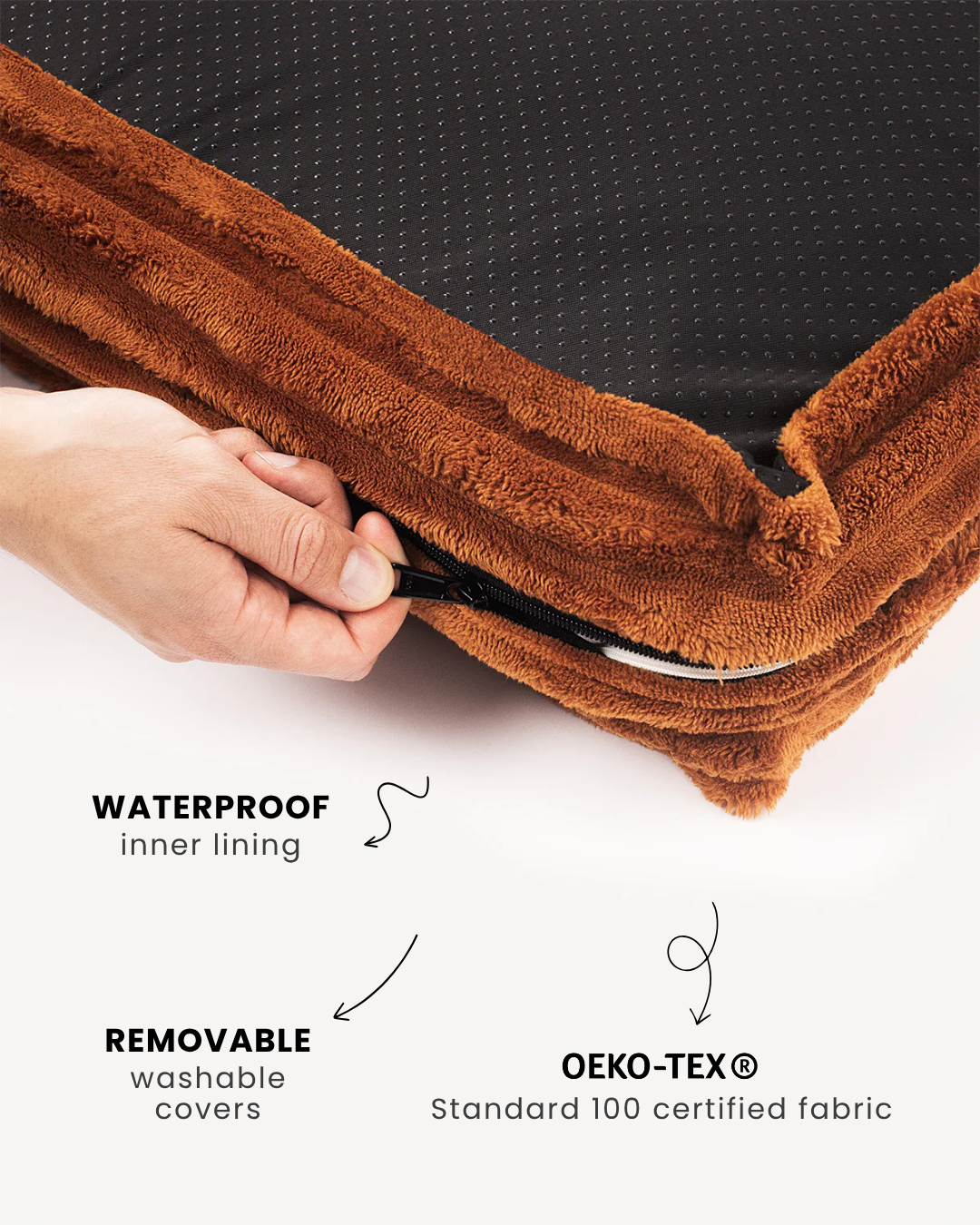 Brown fabric with waterproof inner lining and OEKO-TEX certification, held by a hand.
