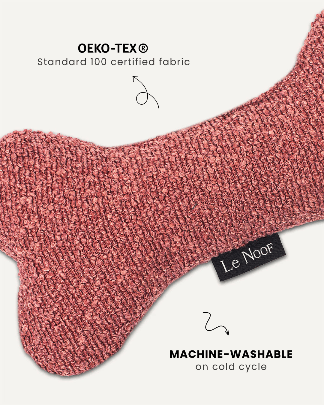 Dusty pink boucle bone dog toy close-up, Le Noof