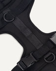 Black dog harness with Le Noof logo super closeup