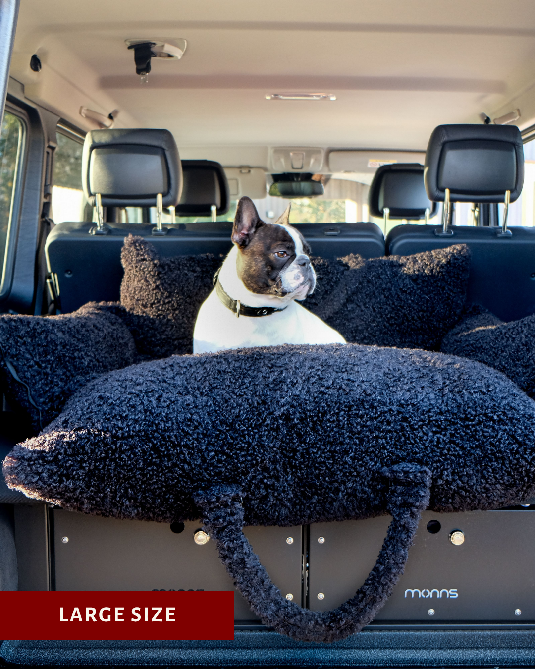 Black teddy travel car dog bed in a car trunk, Le Noof