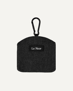 Black black washed denim dog treat pouch with carabiner and 'Le Noof' label on a white background