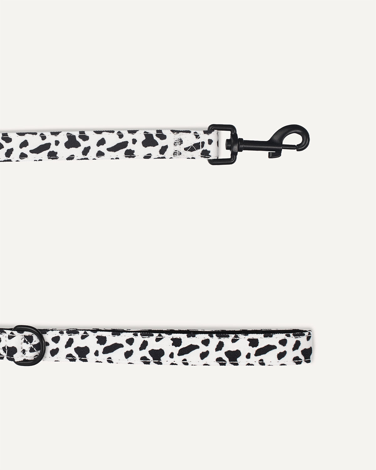 Cow print dog leash made by Le Noof close up image