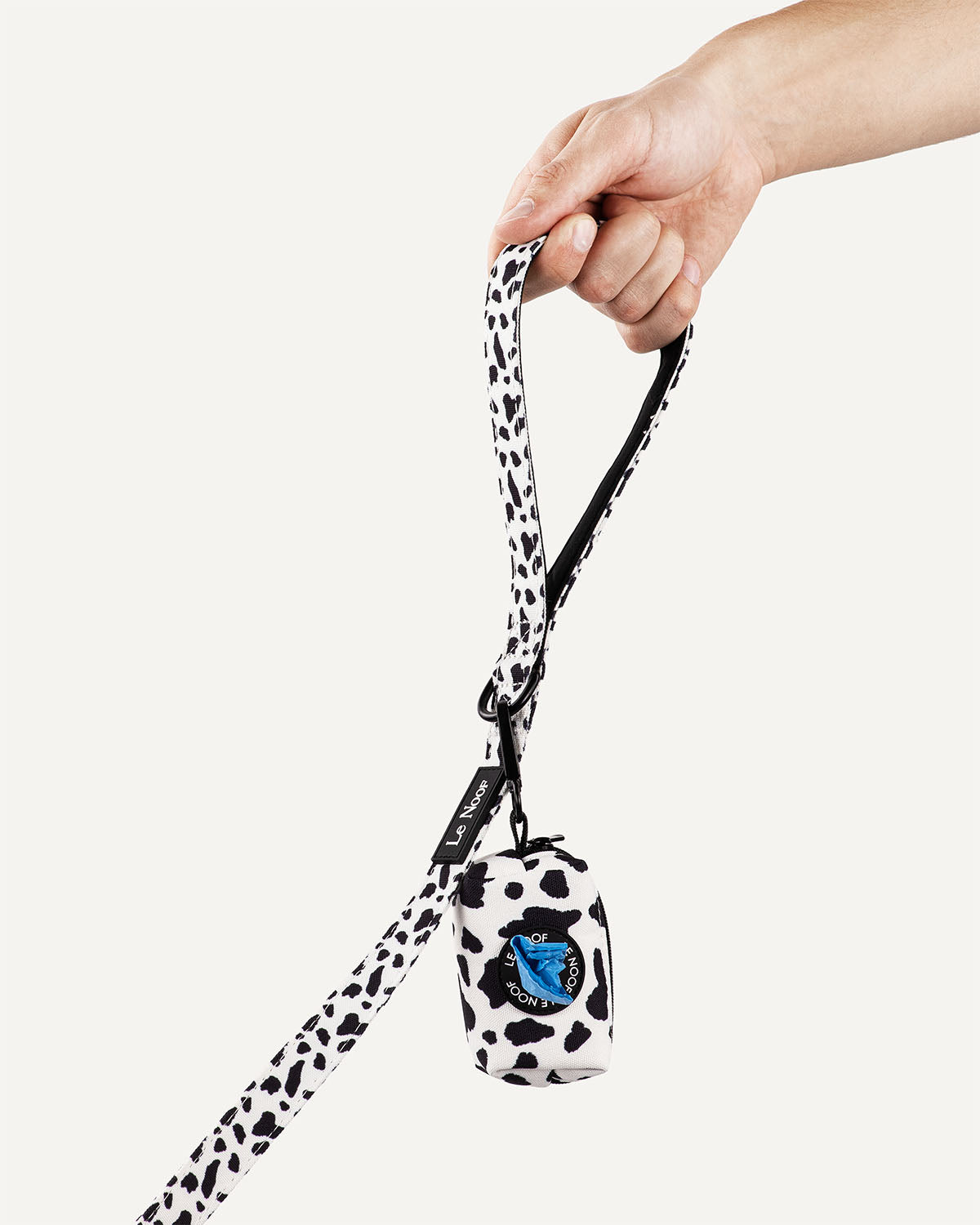 Cow print dog leash with poop bag holder with Le Noof logo