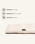 cream white boucle floor dog pillow with badges