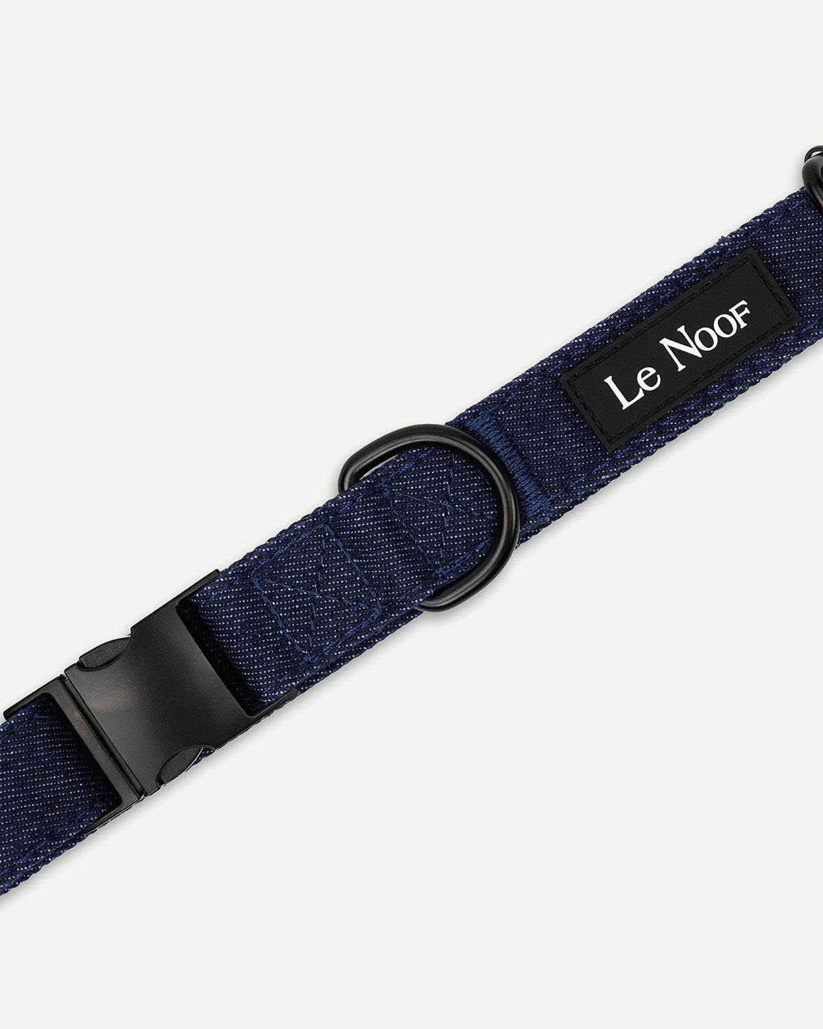 Dark blue denim dog collar close up image with Le Noof logo