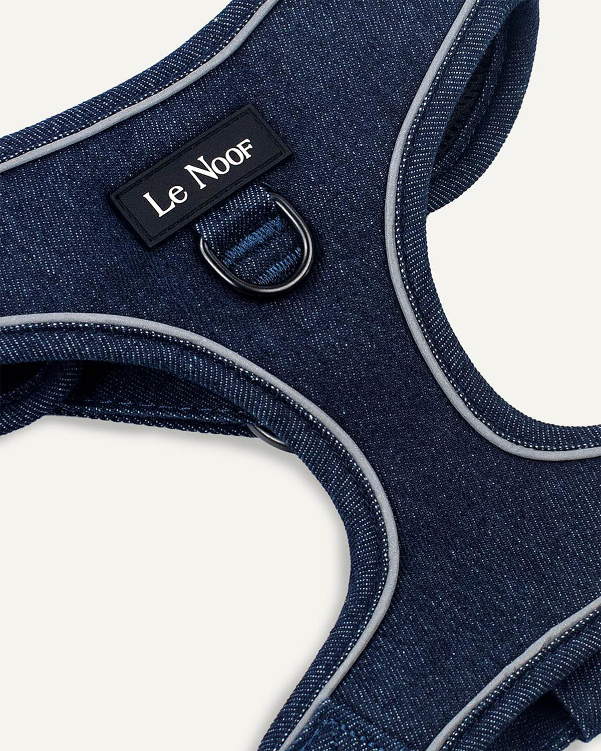 Dark blue denim dog harness with Le Noof logo super closeup