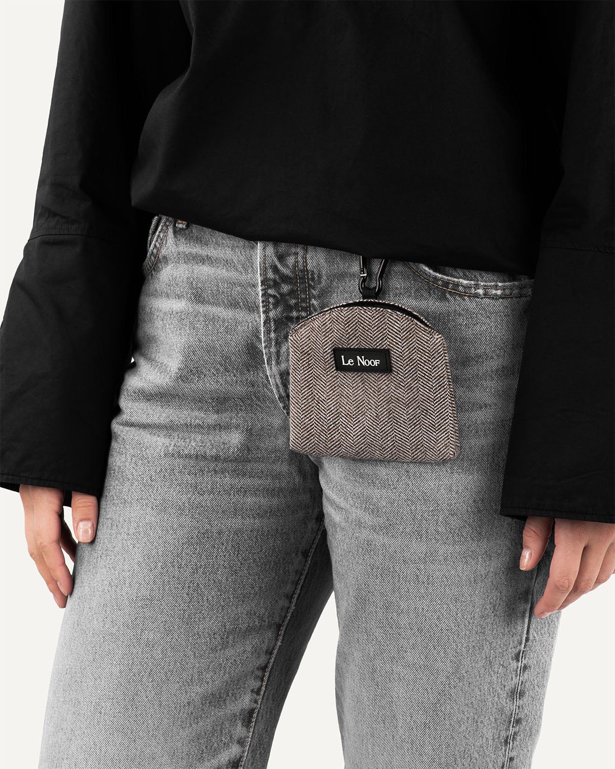Person wearing dark brown cotton dog treat pouch made by Le Noof