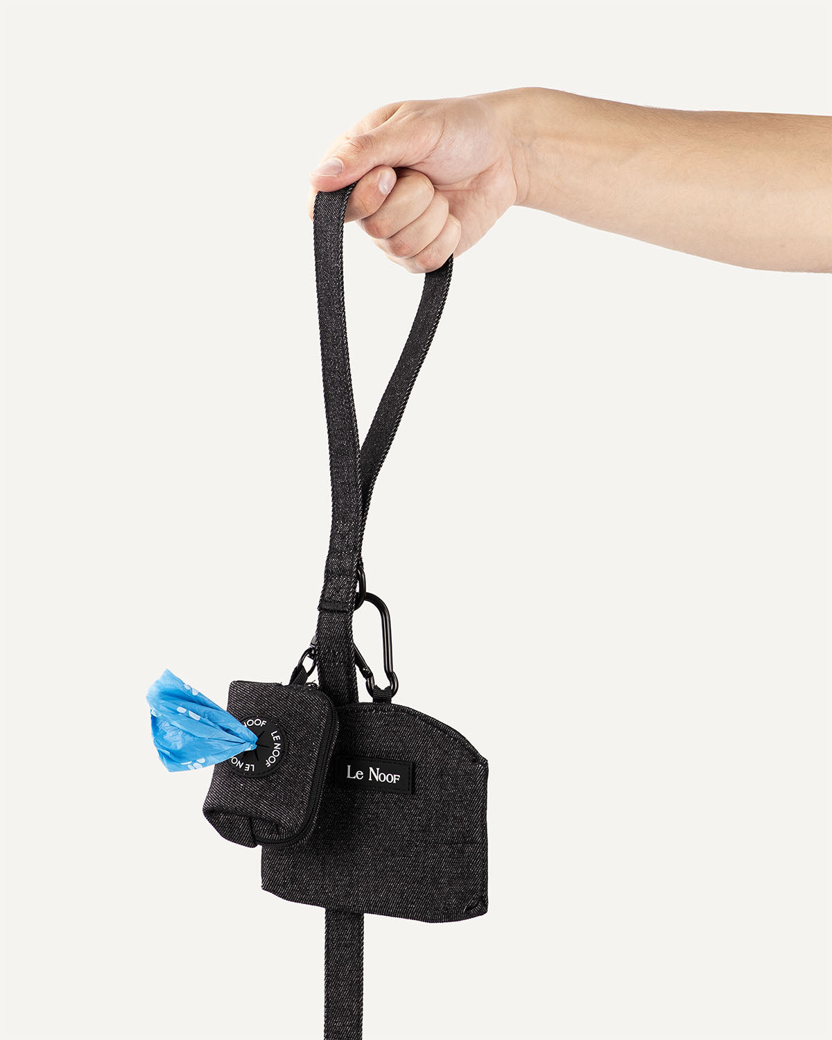 Dark washed denim dog leash with poop bag holder and treat pouch clipped to it