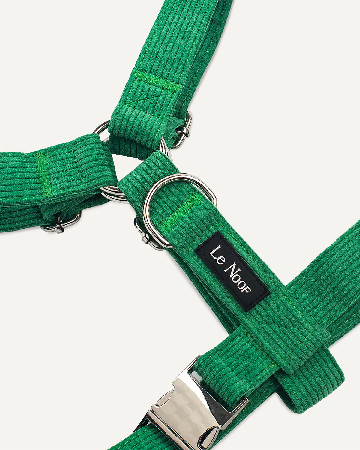 Kelly green dog harness with Le Noof logo super closeup
