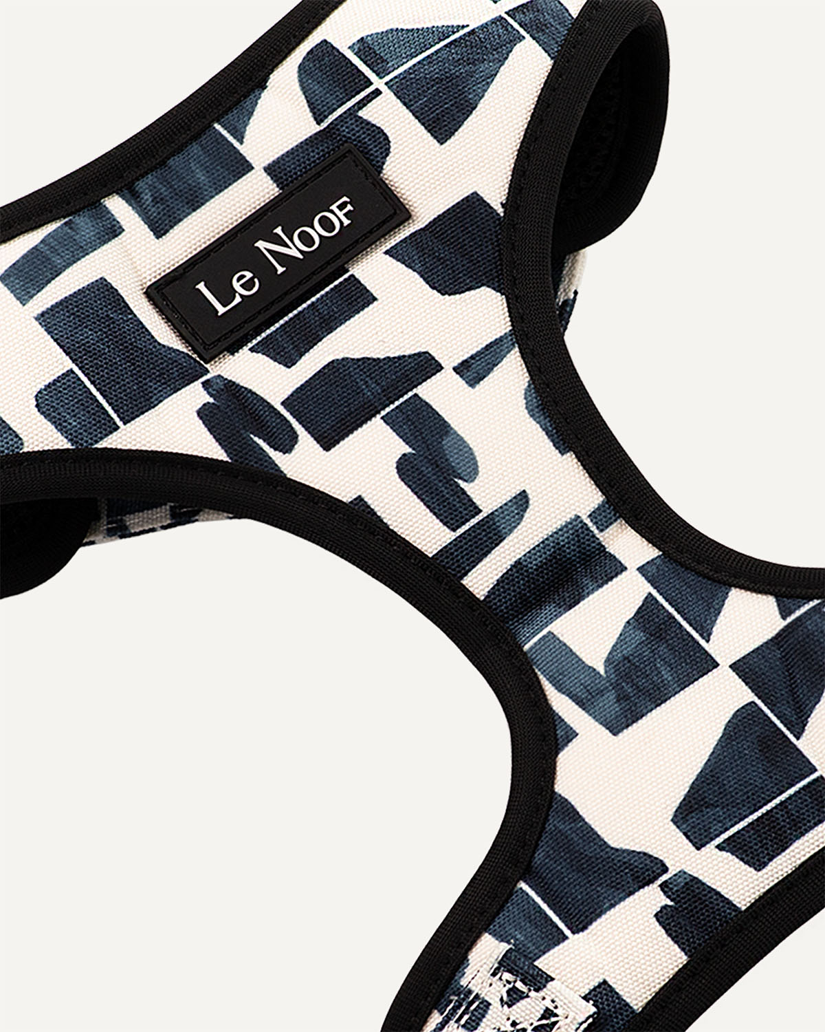 Modern geometric print dog harness with Le Noof logo super closeup