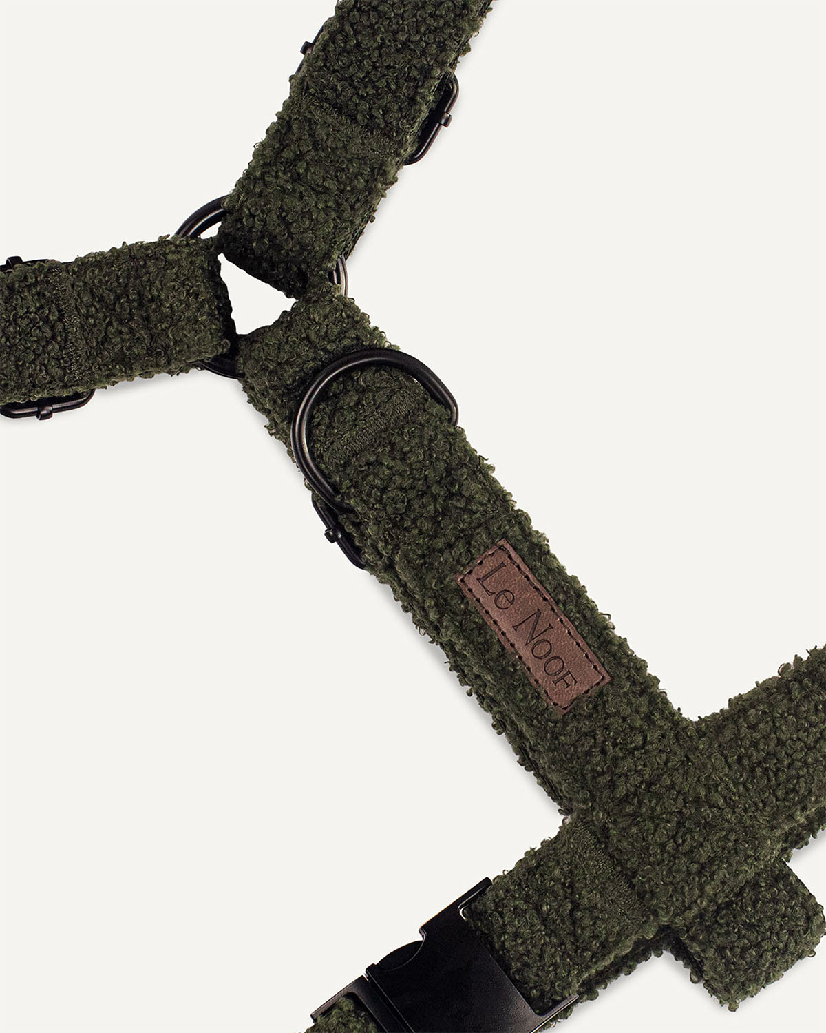 Moss green teddy dog harness with Le Noof logo super closeup